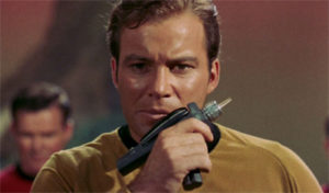 Kirk licks a phaser pistol, apparently?