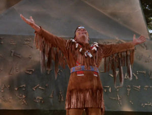 Kirk in a Native American costume that exceeds the definition of the word stereotypical.