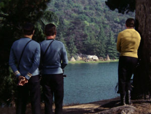 Kirk, Spock and Bones across the lake from the village.