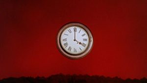 The sky clock, affixed in a red sky.