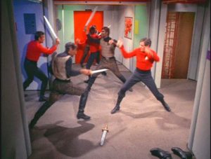 Klingons and the Federation crew fighting with swords.