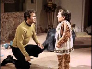 Kirk kneels to reassure Alexander, who is righteously pissed.