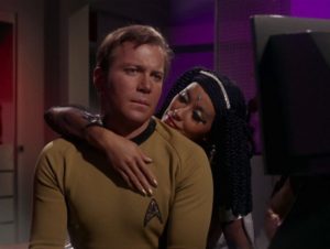 Elaan caresses Kirk after whammying him with her magical tears. Yes. For real.