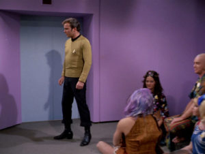 Kirk turns away from the space-hippies staging a sit-in in his transporter room, to collect himself